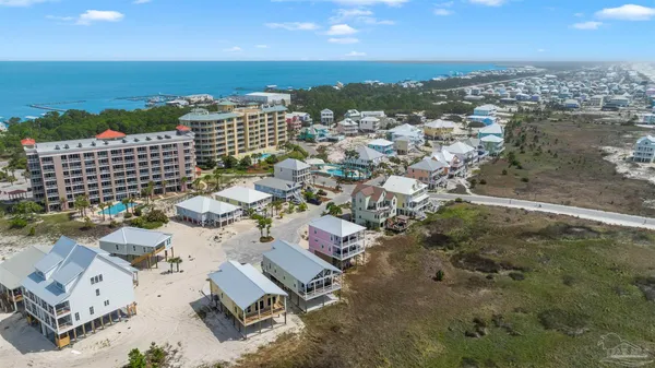 an aerial view of a city with ocean view