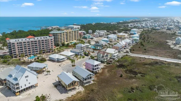 an aerial view of a city with ocean view