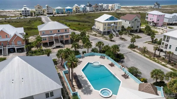 an aerial view of a house with outdoor space