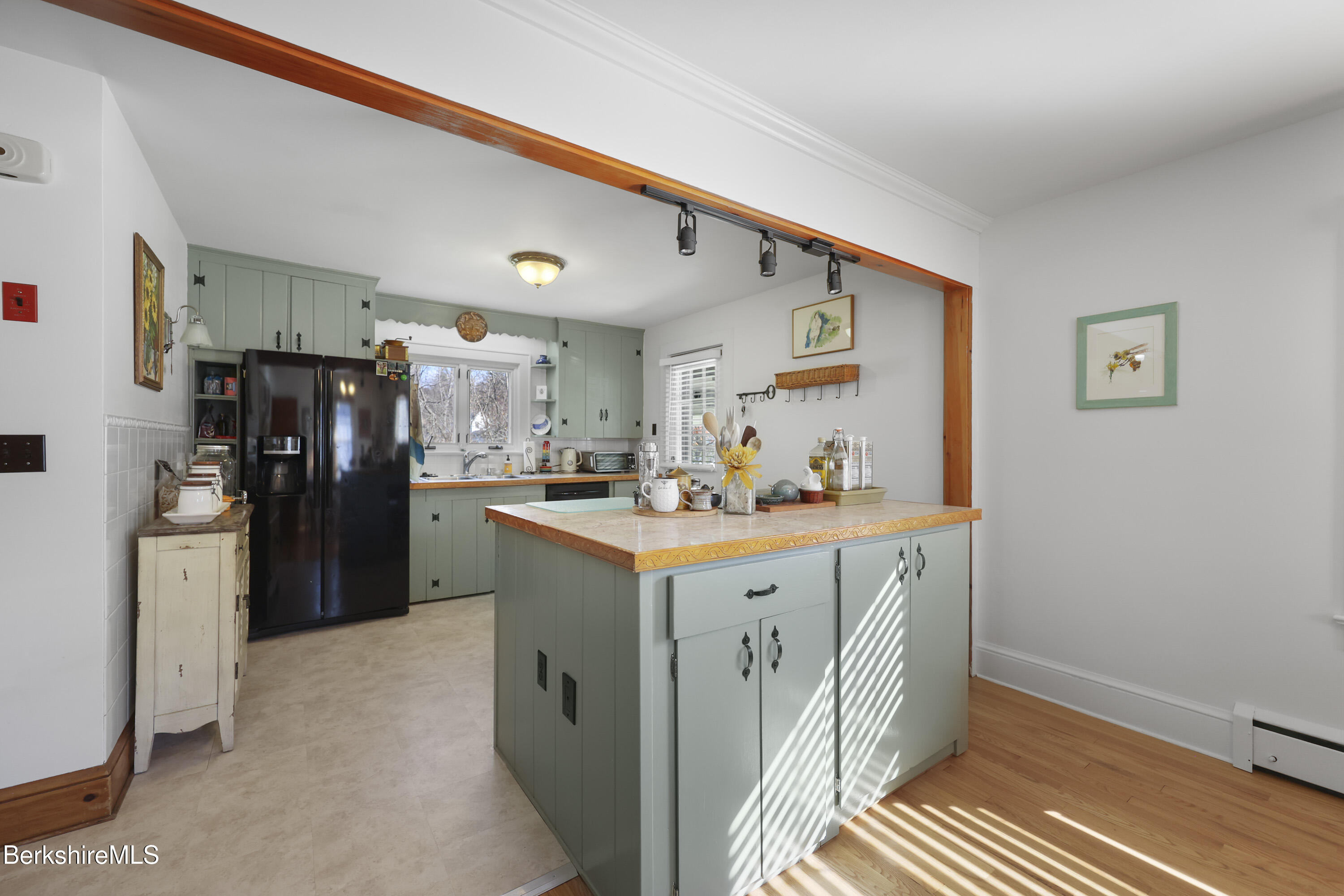 39 Lowden Street Pittsfield, MA 01201 - Photo 12 of 42 a kitchen with refrigerator cabinets and wooden floor