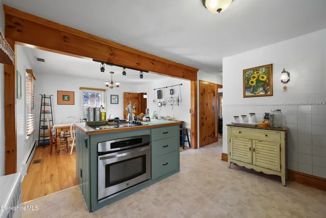 a kitchen with stove and cabinets