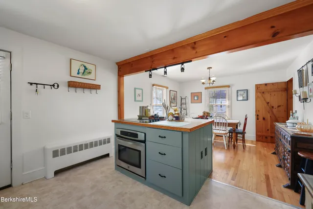 a living room with furniture and a dining table