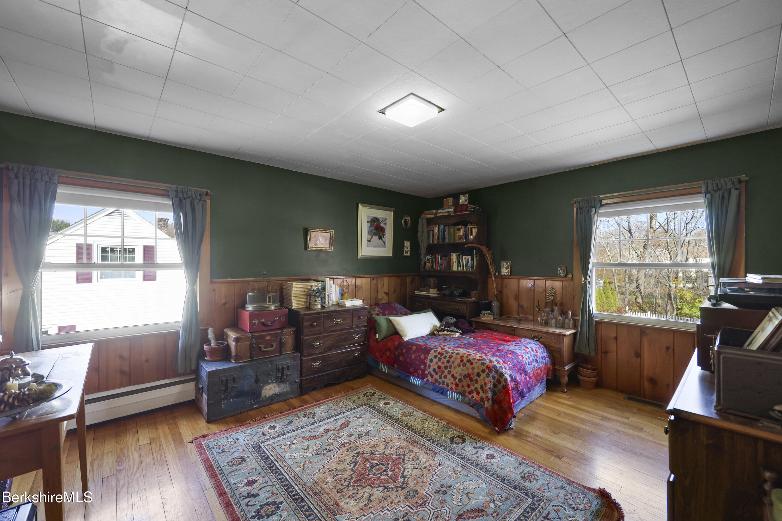 39 Lowden Street Pittsfield, MA 01201 - Photo 30 of 42 a bedroom with a bed and wooden floor