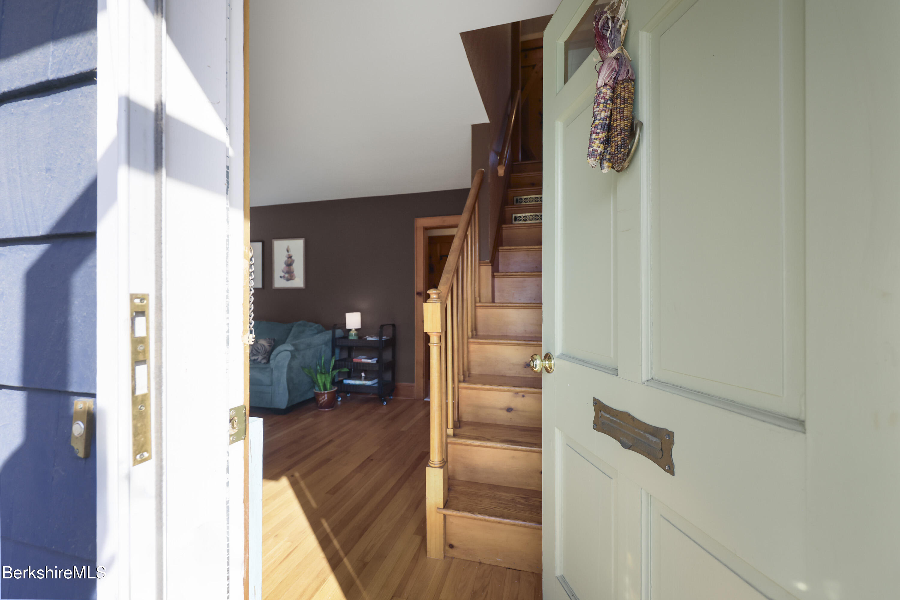 39 Lowden Street Pittsfield, MA 01201 - Photo 3 of 42 a view of a hallway and a livingroom with furniture