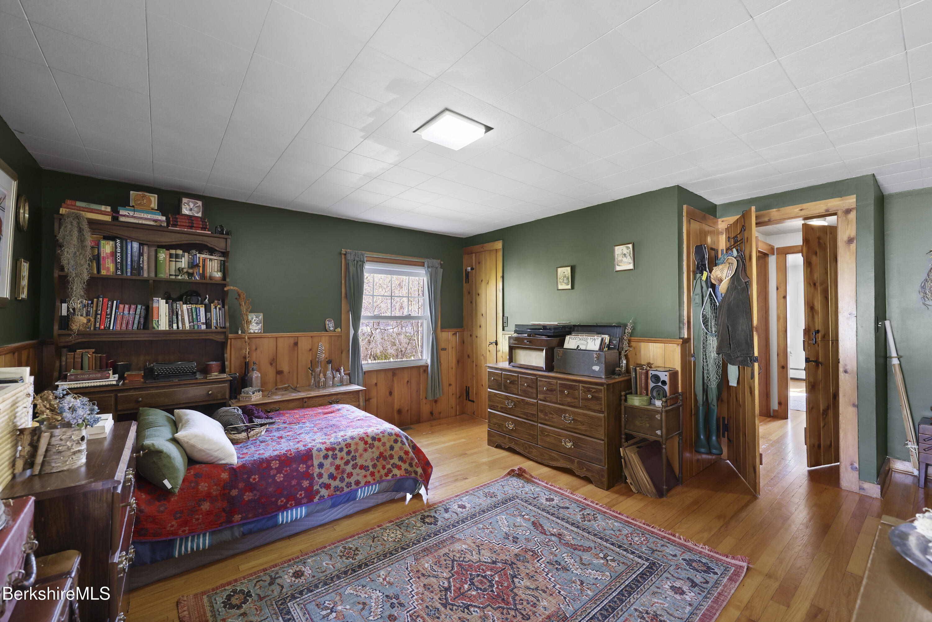 39 Lowden Street Pittsfield, MA 01201 - Photo 31 of 42 a bedroom with a bed and wooden floor