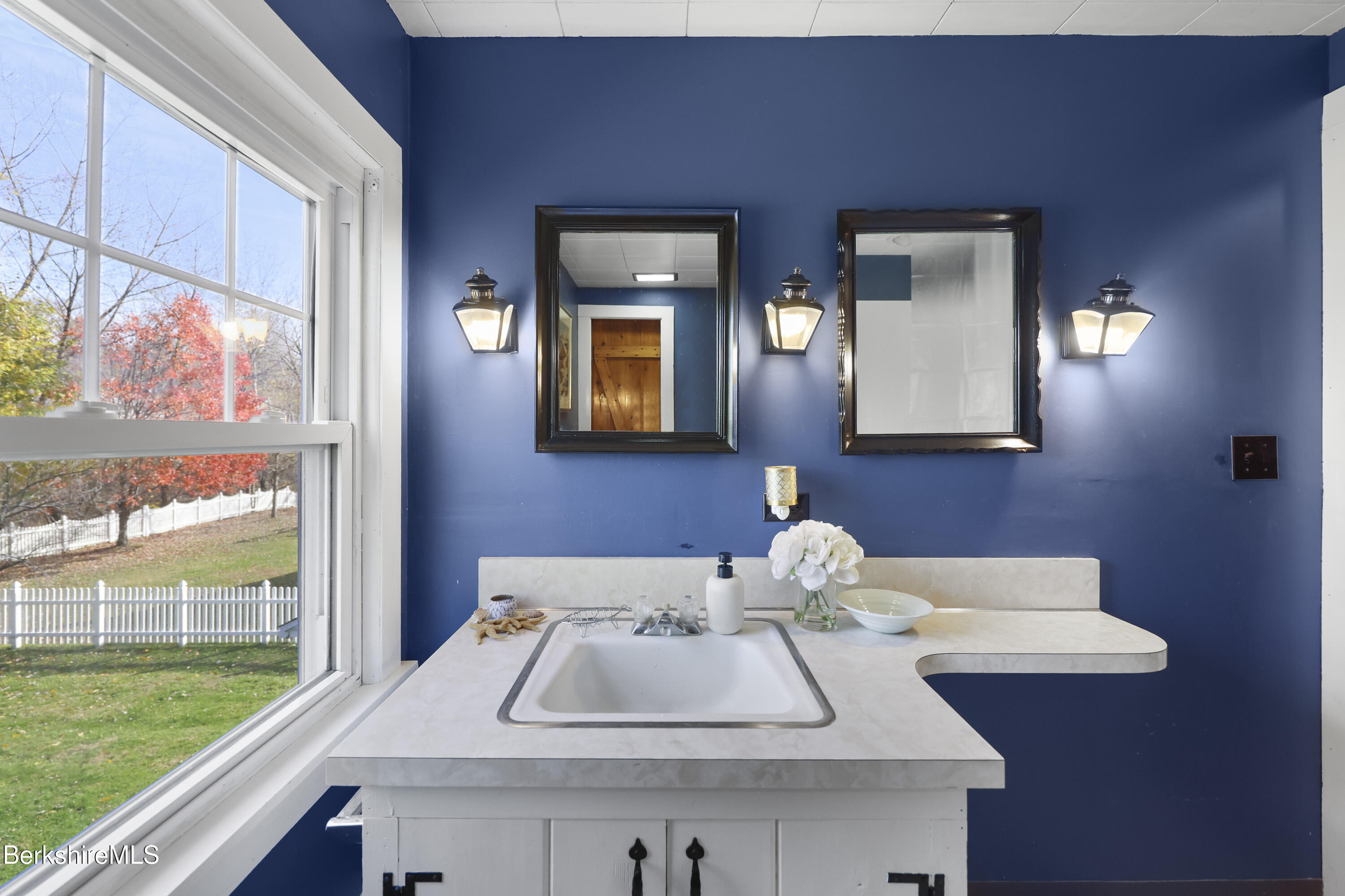 39 Lowden Street Pittsfield, MA 01201 - Photo 33 of 42 a bathroom with a sink and a mirror