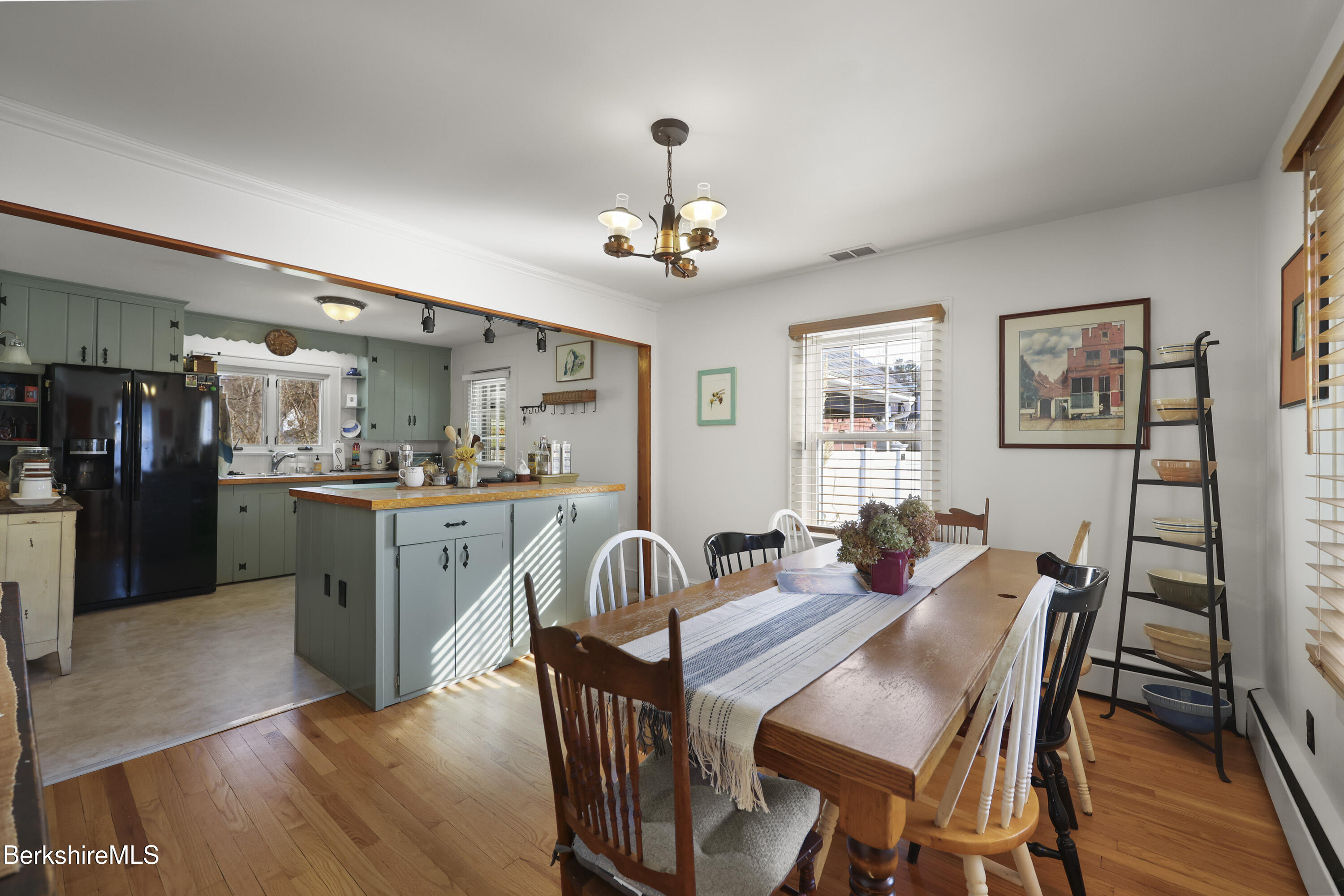 39 Lowden Street Pittsfield, MA 01201 - Photo 9 of 42 a view of a dining room with furniture wooden floor and a chandelier