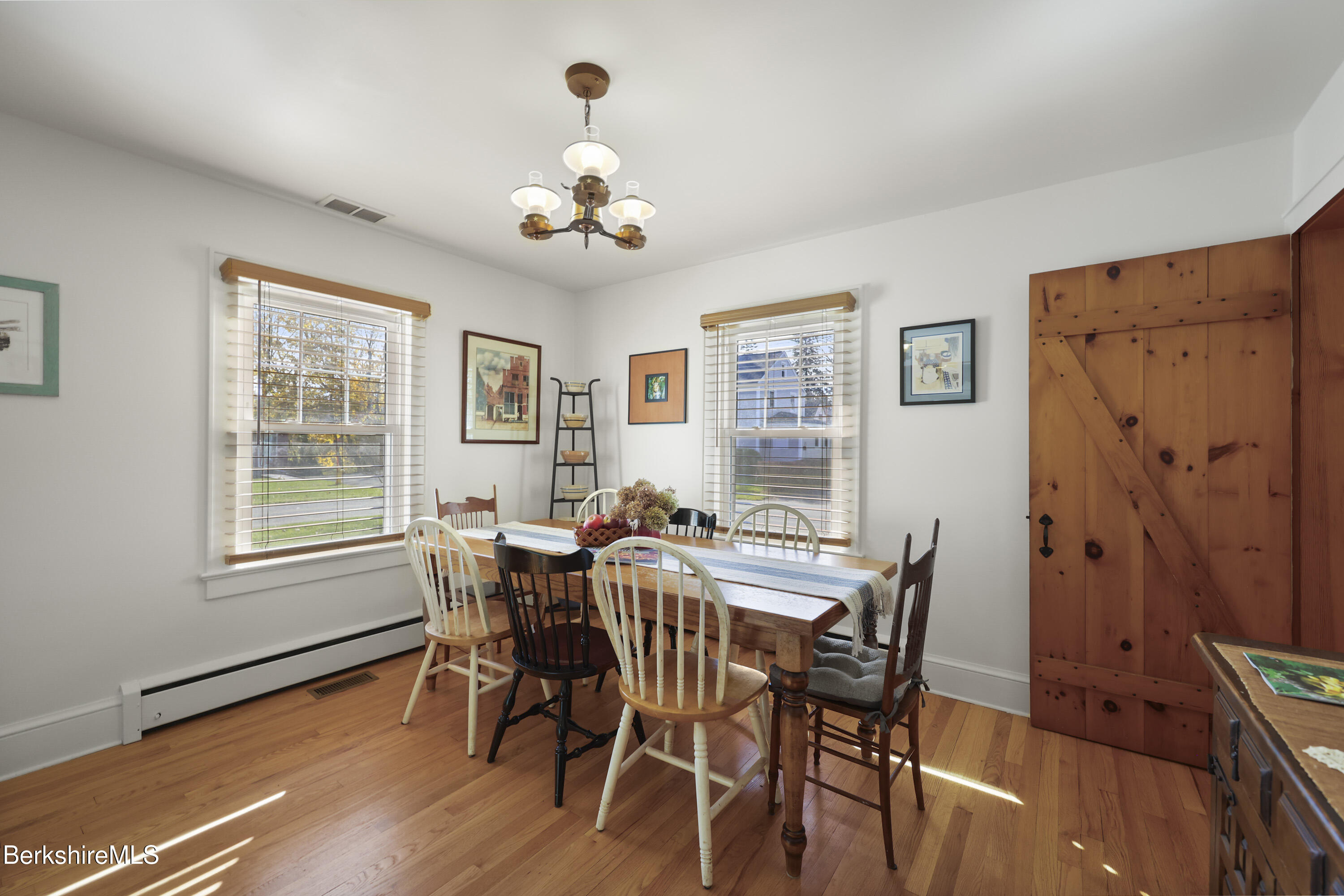 39 Lowden Street Pittsfield, MA 01201 - Photo 10 of 42 a view of a dining room with furniture wooden floor and a chandelier