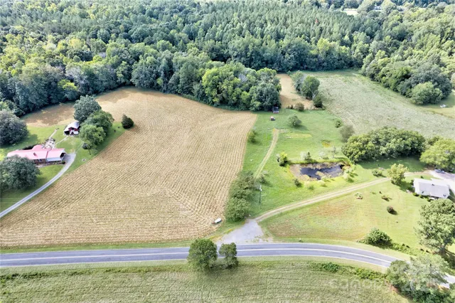 a backyard of a house with a yard and lake