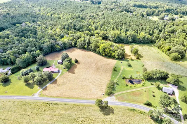 a view of a swimming pool with a yard
