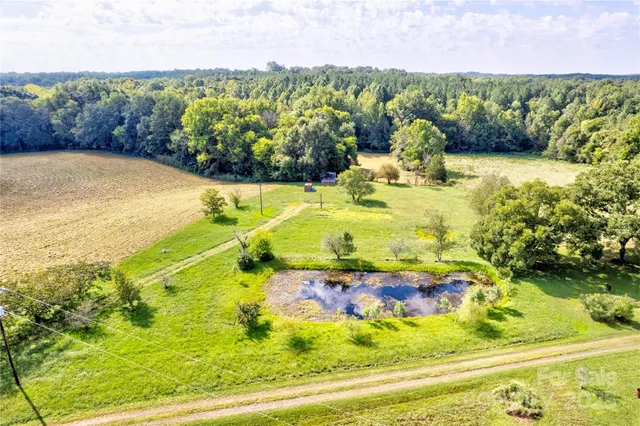 a view of a swimming pool with a yard