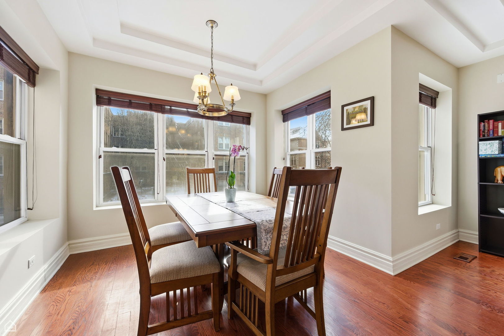 838 East 52nd Street, Unit 1W Chicago, IL 60615 - Photo 12 of 32 a view of a dining room with furniture window and wooden floor