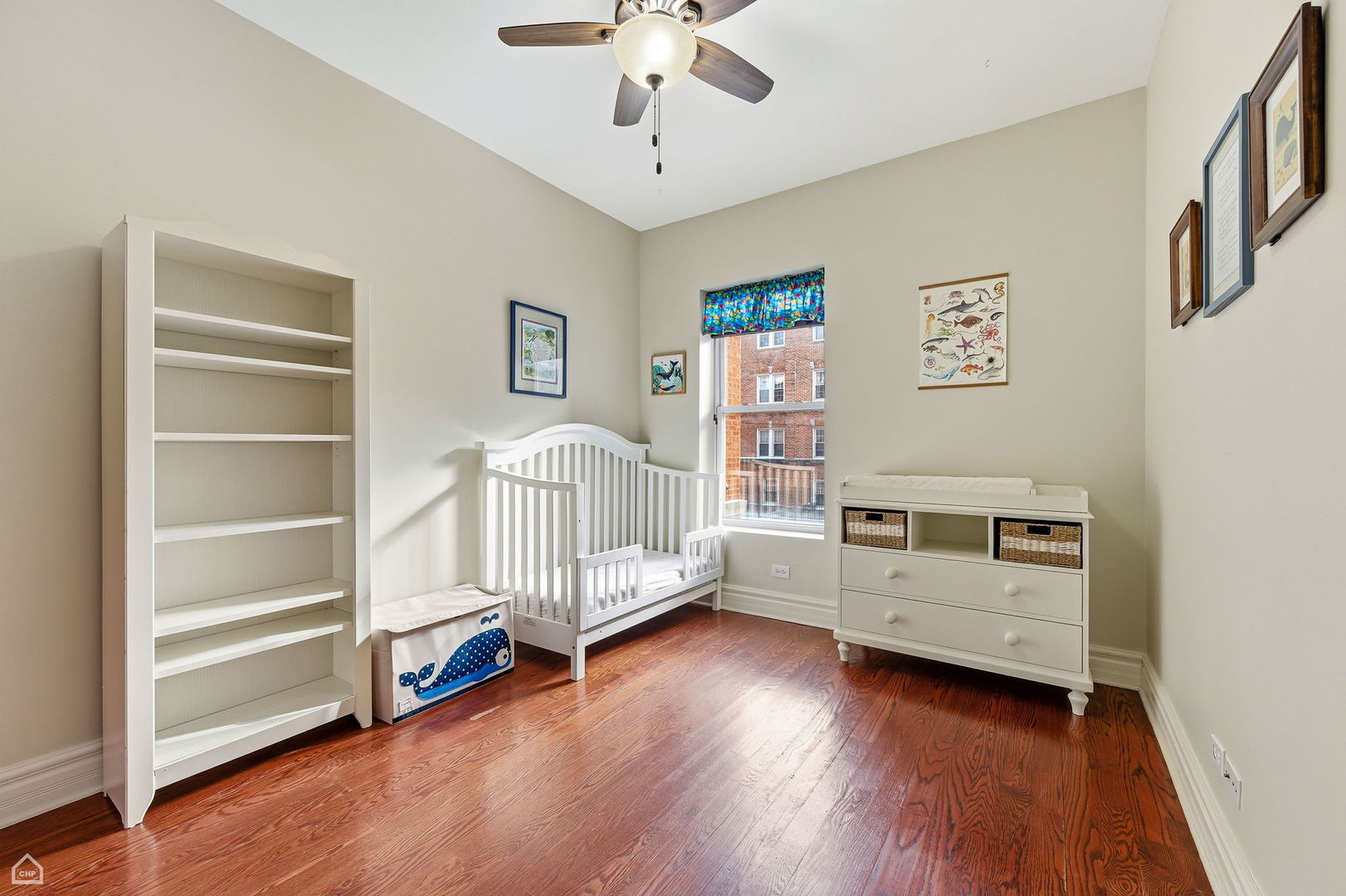 838 East 52nd Street, Unit 1W Chicago, IL 60615 - Photo 13 of 32 a living room with hard wood floors and furniture
