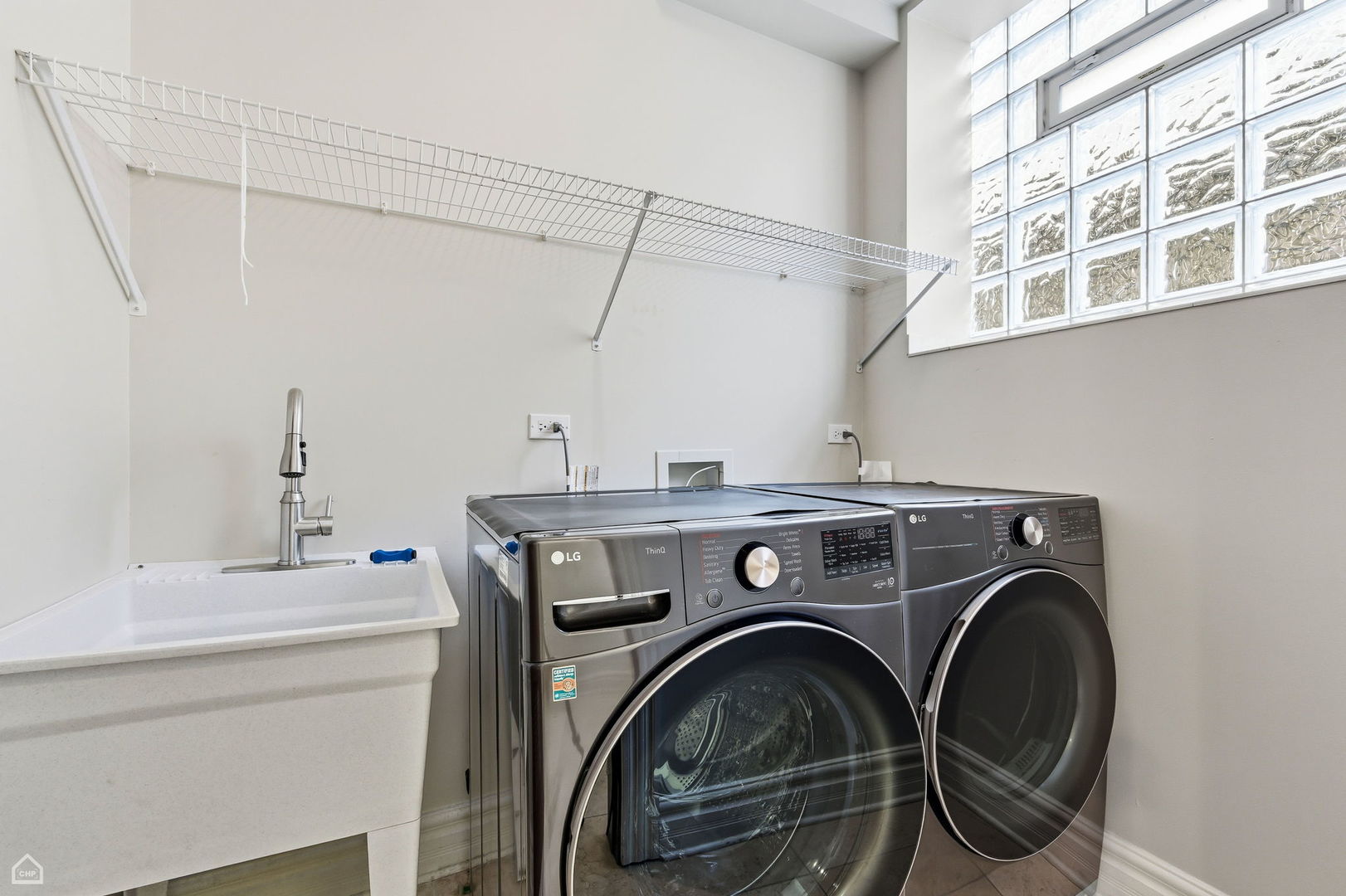838 East 52nd Street, Unit 1W Chicago, IL 60615 - Photo 23 of 32 a utility room with dryer and washer