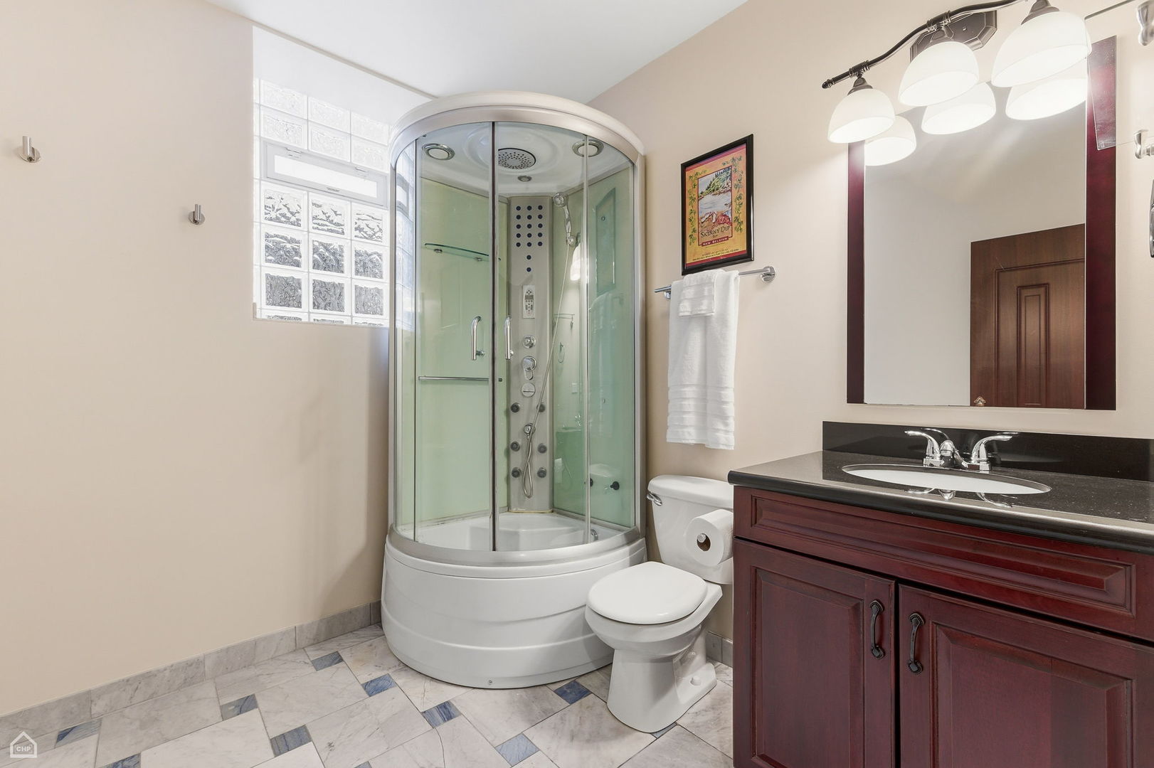 838 East 52nd Street, Unit 1W Chicago, IL 60615 - Photo 25 of 32 a bathroom with a granite countertop sink toilet a mirror a vanity and shower