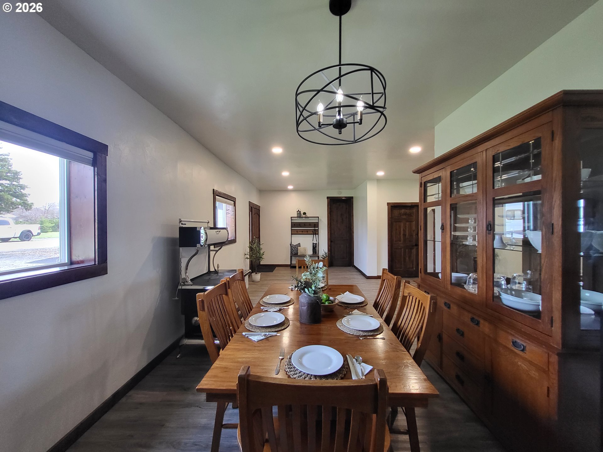 403 North Lake Street Joseph, OR 97846 - Photo 16 of 46 a view of a dining room with furniture large window and wooden floor
