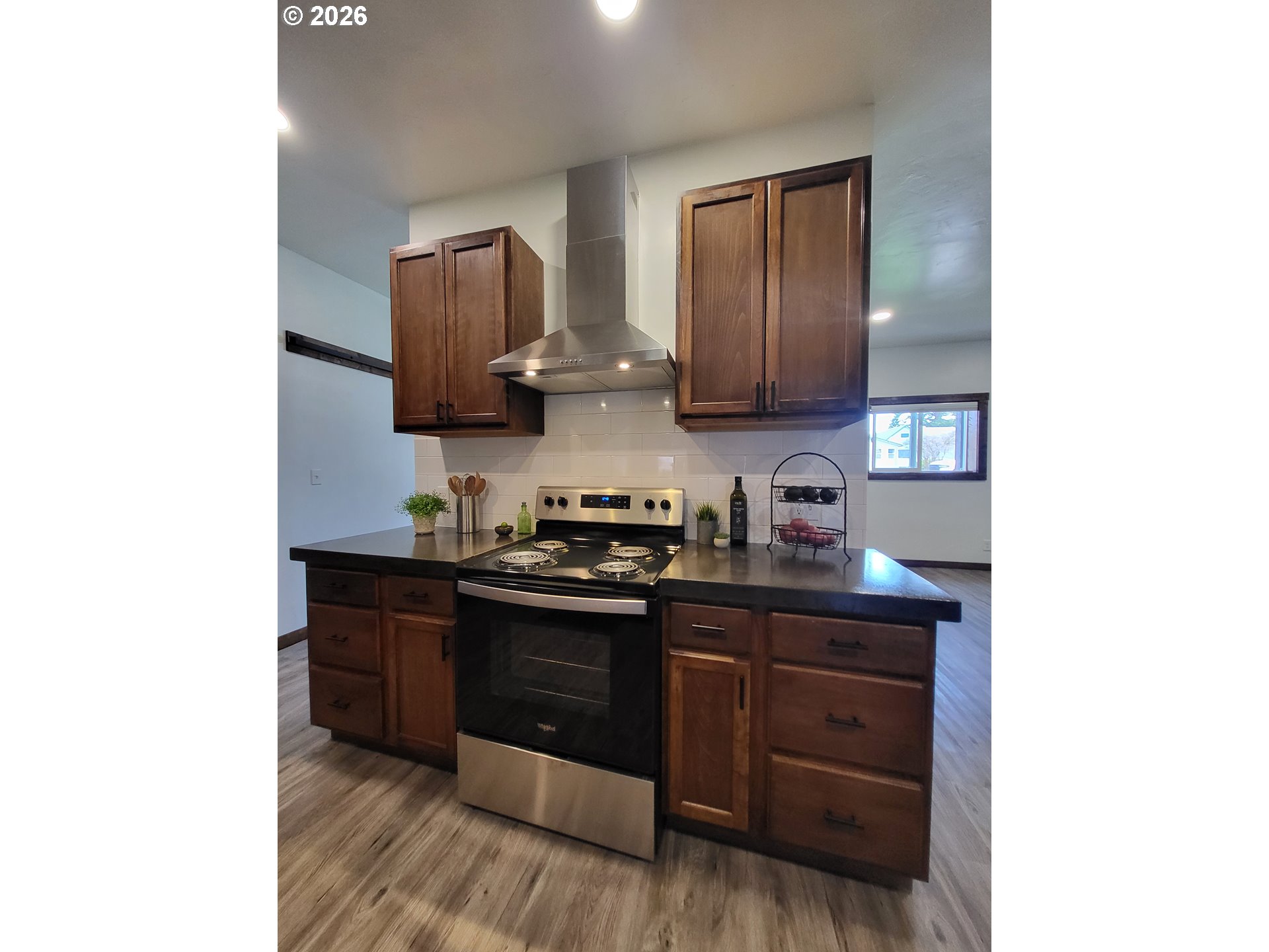 403 North Lake Street Joseph, OR 97846 - Photo 19 of 46 a kitchen with stainless steel appliances granite countertop a stove and a sink