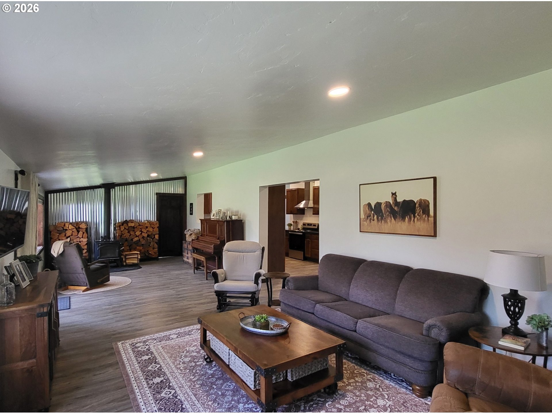 403 North Lake Street Joseph, OR 97846 - Photo 22 of 46 a living room with furniture a rug and wall painting