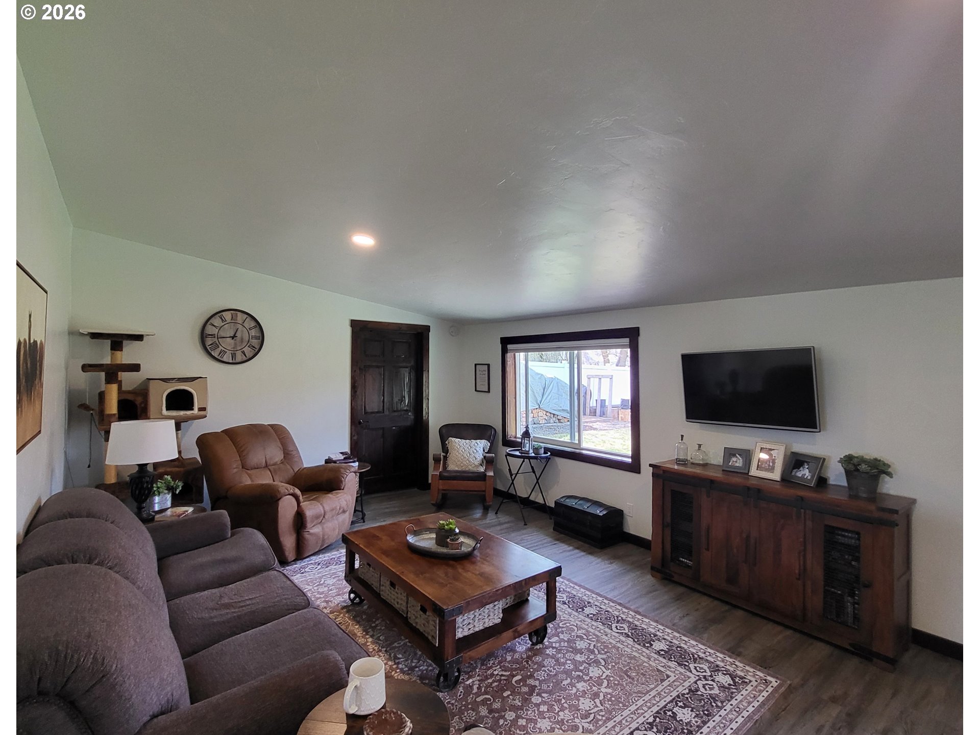 403 North Lake Street Joseph, OR 97846 - Photo 23 of 46 a living room with furniture and a flat screen tv