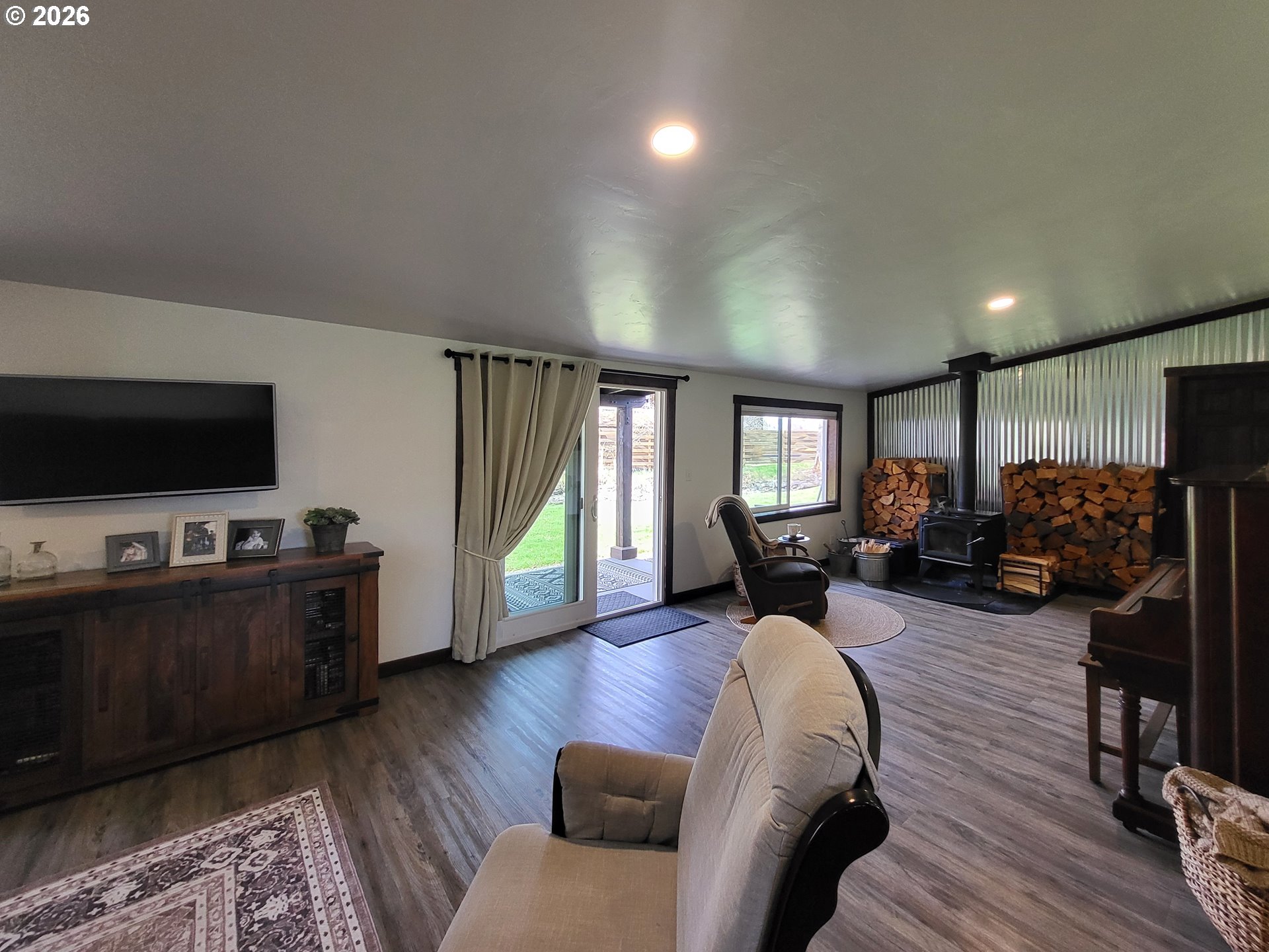 403 North Lake Street Joseph, OR 97846 - Photo 24 of 46 a living room with furniture and a flat screen tv