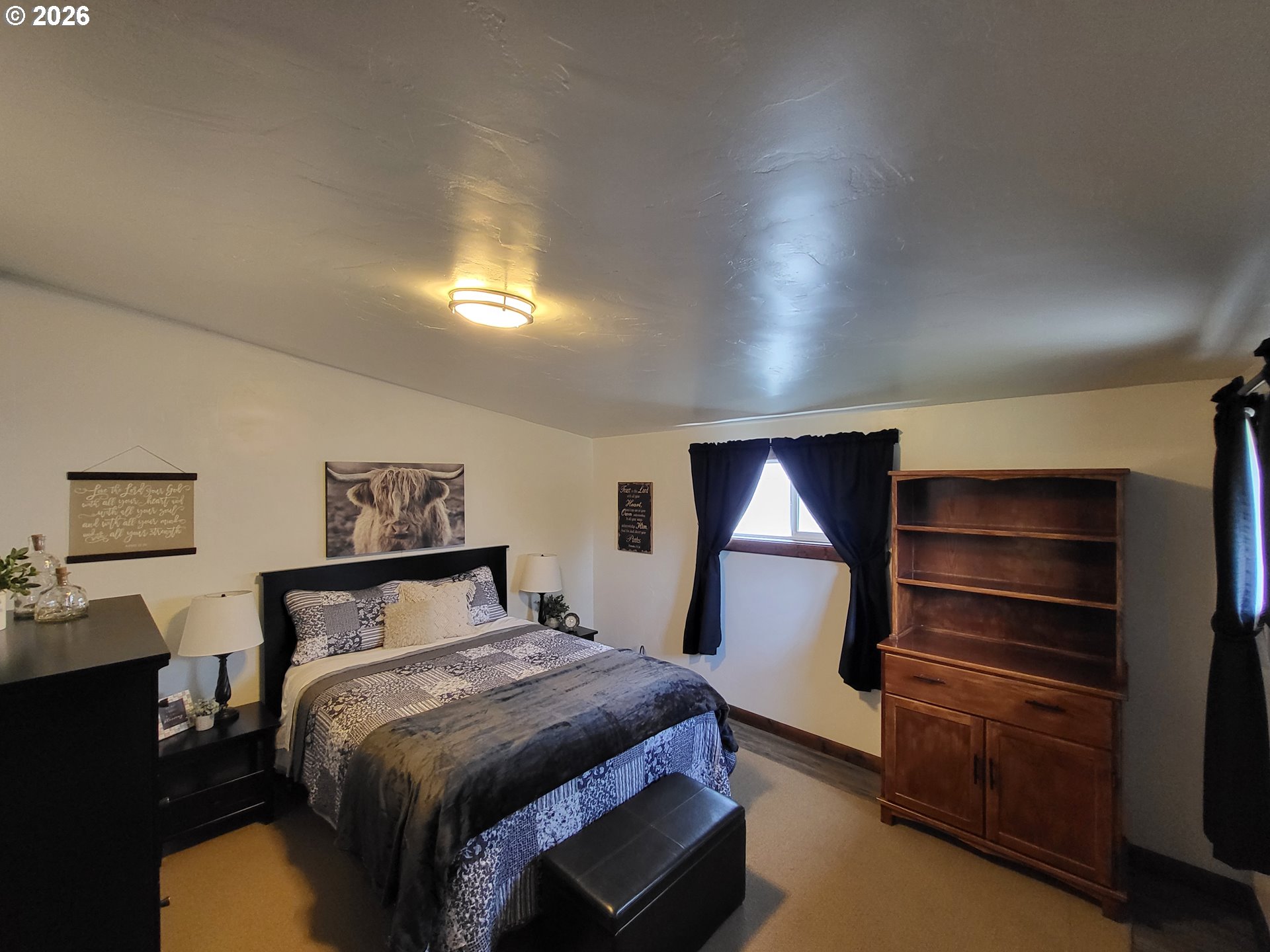 403 North Lake Street Joseph, OR 97846 - Photo 31 of 46 a bedroom with a bed and a night stand
