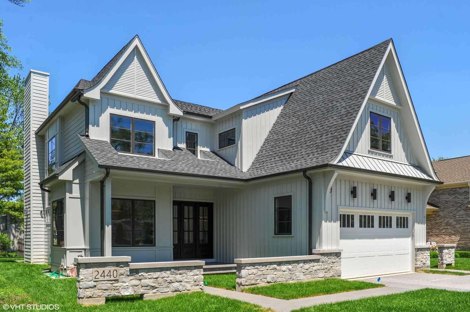 a front view of a house with garden