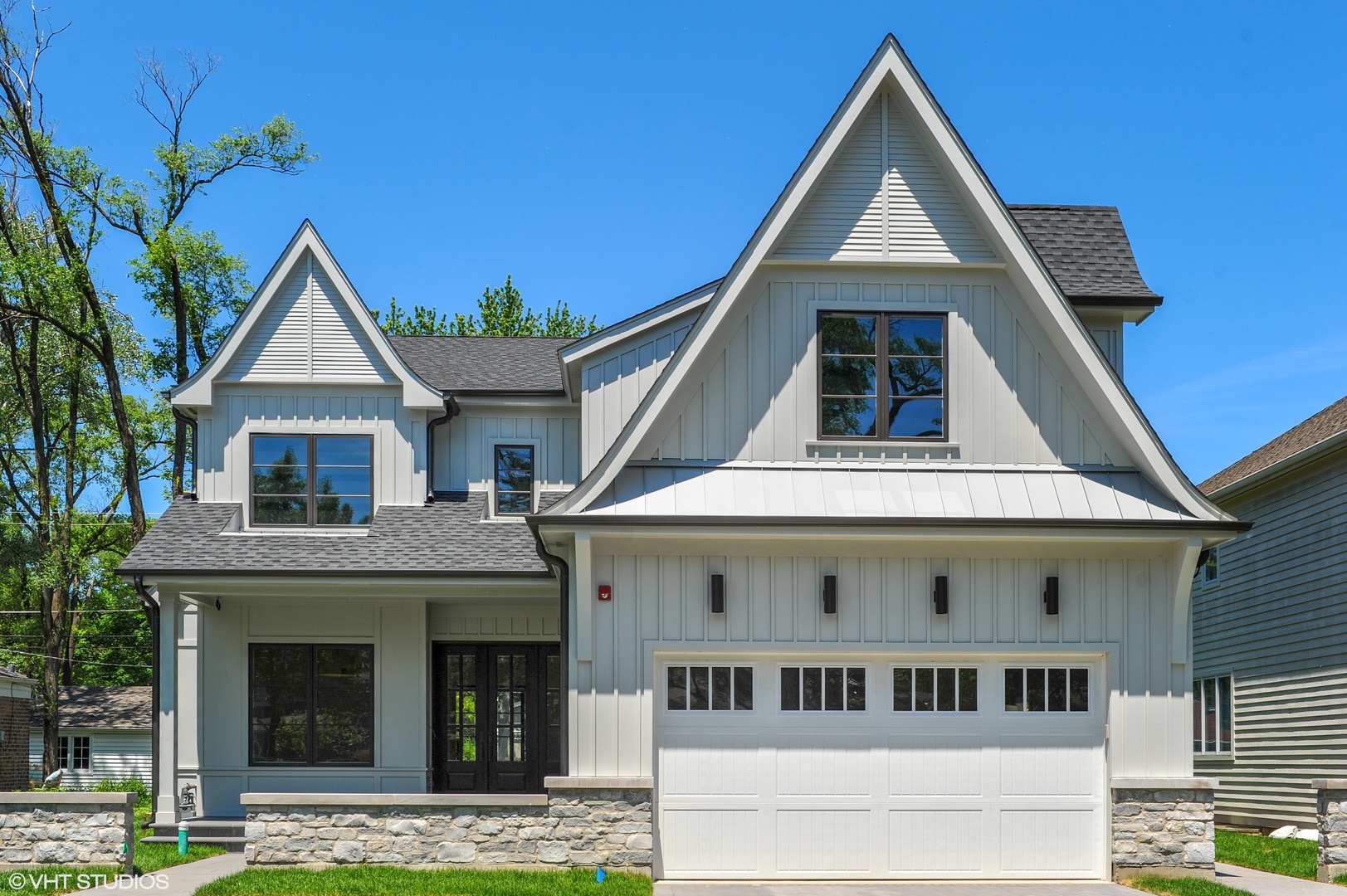 2440 Illinois Road Northbrook, IL 60062 - Photo 2 of 18 a view of a white house with a big yard and potted plants