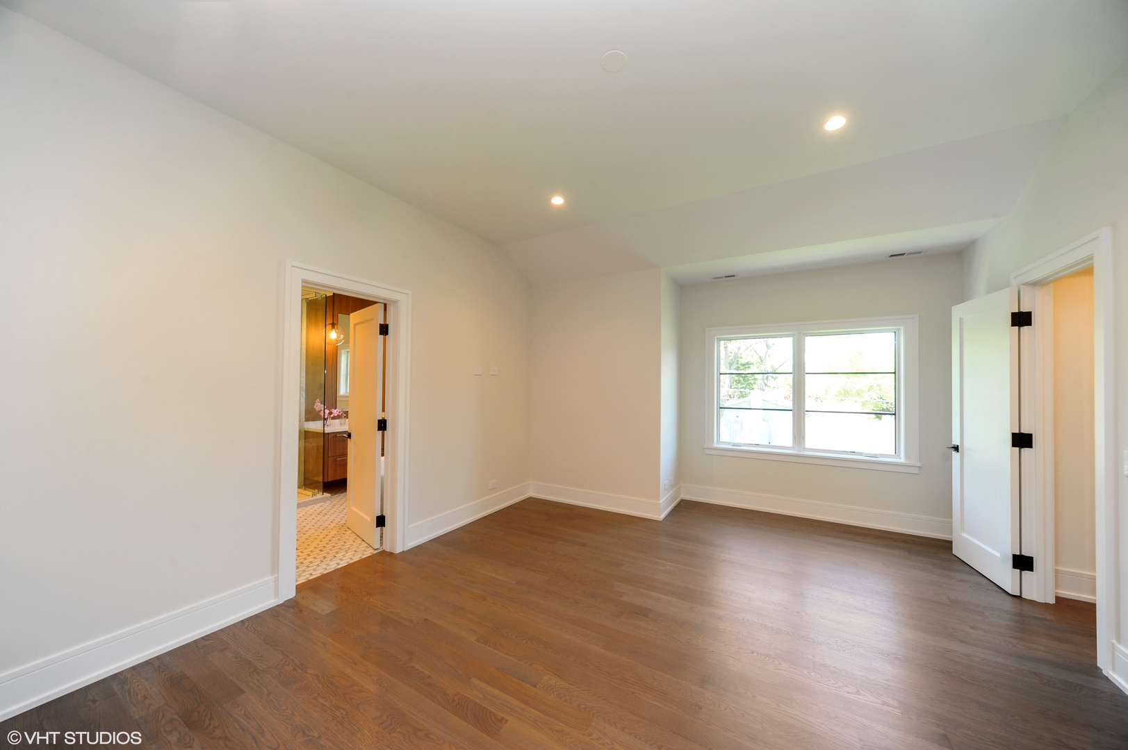 2440 Illinois Road Northbrook, IL 60062 - Photo 11 of 18 an empty room with wooden floor and windows