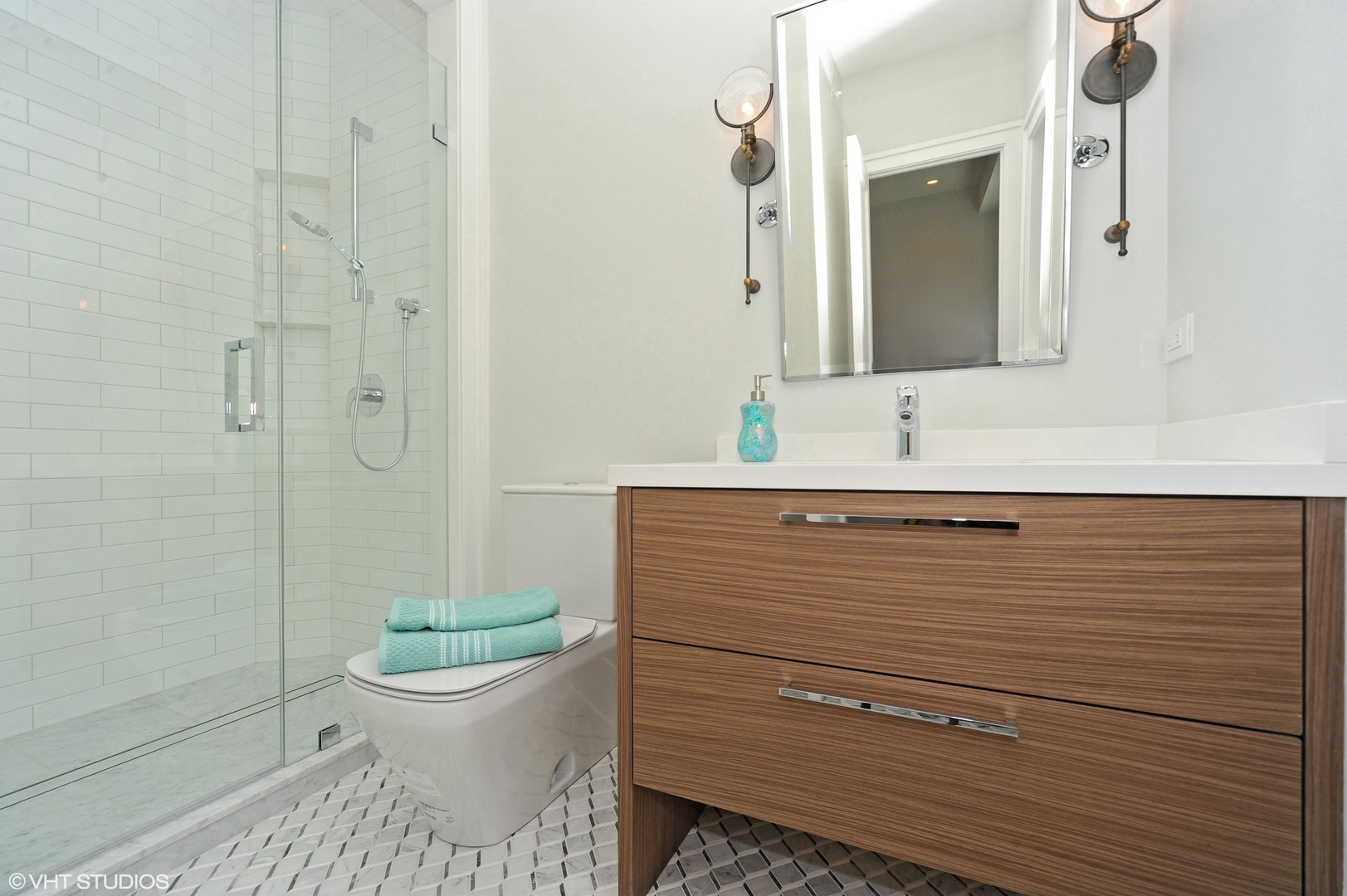 2440 Illinois Road Northbrook, IL 60062 - Photo 14 of 18 a bathroom with a sink toilet and shower