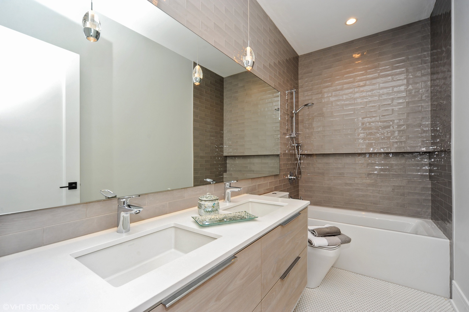 2440 Illinois Road Northbrook, IL 60062 - Photo 15 of 18 a bathroom with a granite countertop sink a toilet a mirror and bathtub