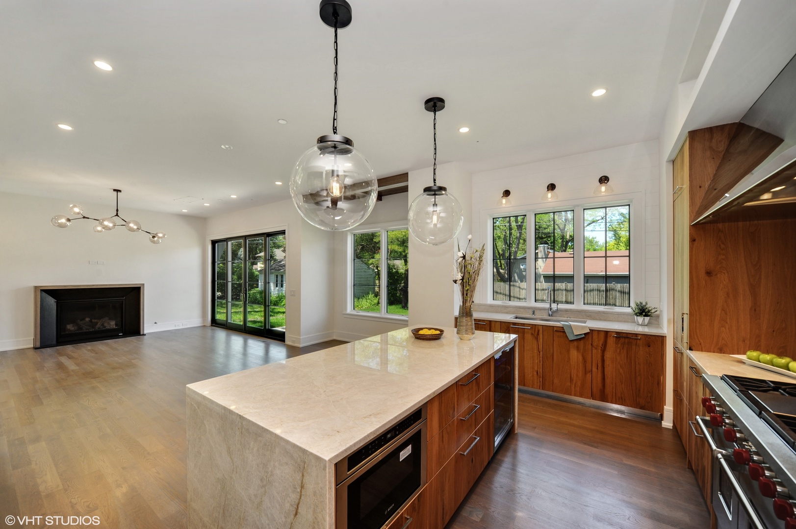 2440 Illinois Road Northbrook, IL 60062 - Photo 8 of 18 a large kitchen with stainless steel appliances a large center island and a stove