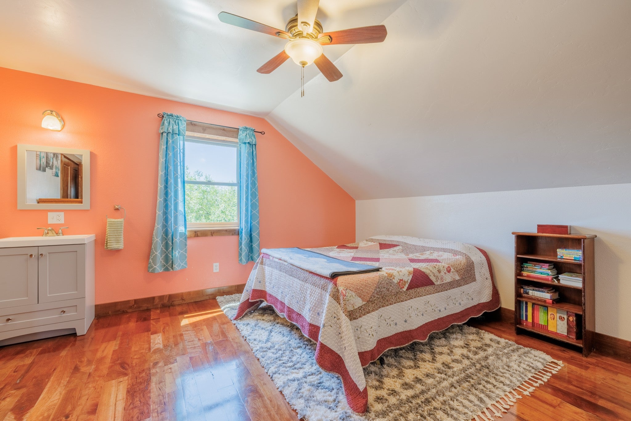 58 Gilman Road Garrison, MT 59731 - Photo 72 of 91 Bedroom featuring light wood-style flooring, vaulted ceiling, and a ceiling fan