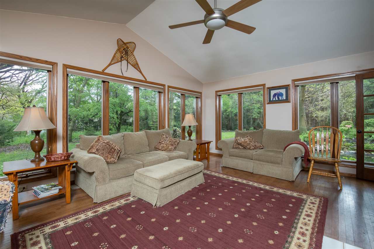 11900 Beloit Road Caledonia, IL 61011 - Photo 15 of 27 a living room with furniture and a floor to ceiling window