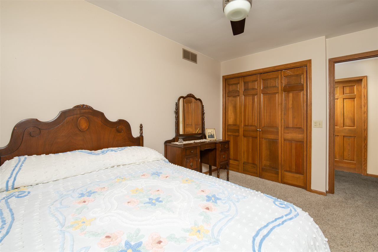 11900 Beloit Road Caledonia, IL 61011 - Photo 24 of 27 a bedroom with a bed and a dresser