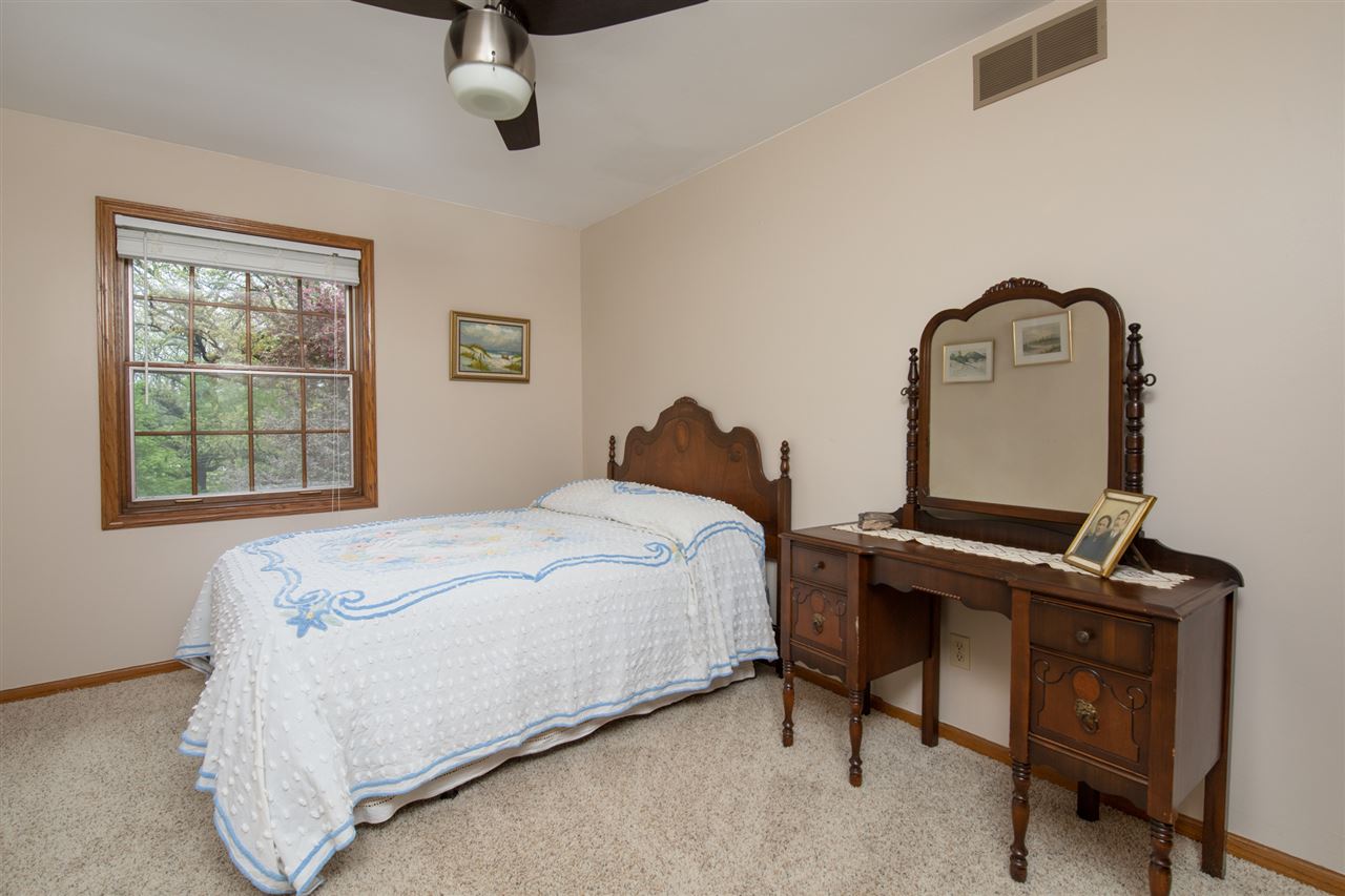 11900 Beloit Road Caledonia, IL 61011 - Photo 25 of 27 a bedroom with a bed and a window