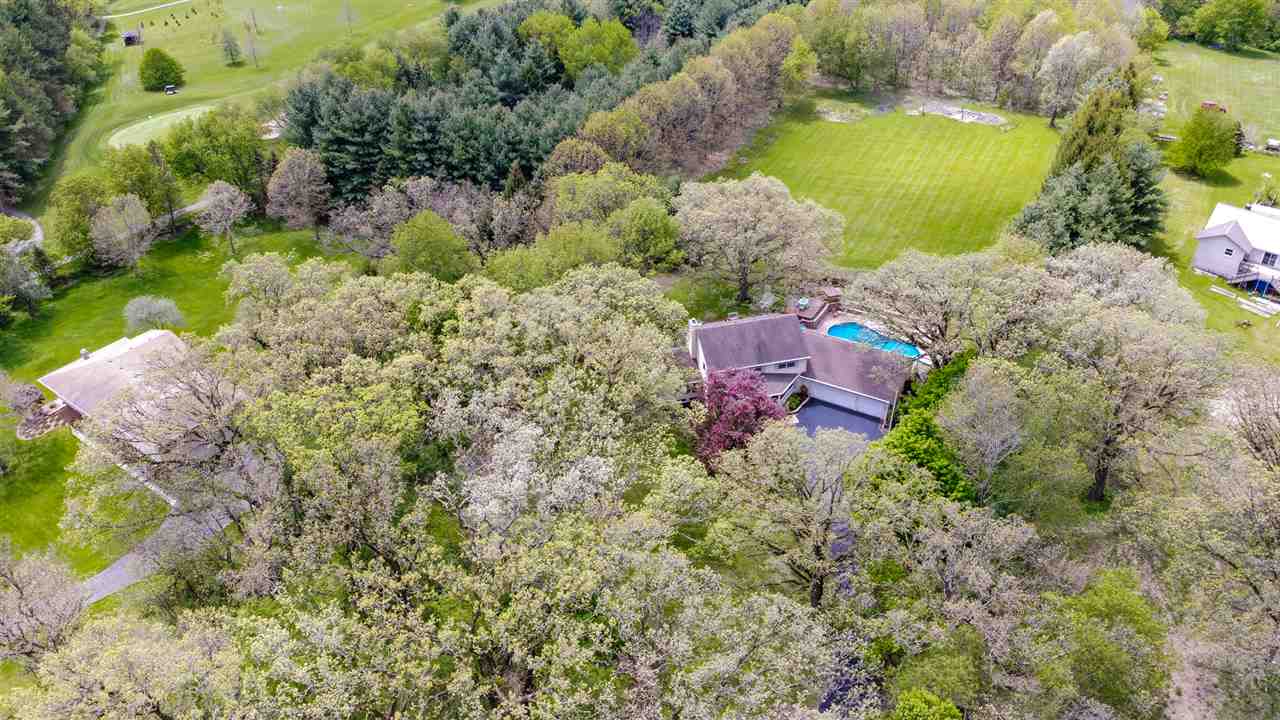 11900 Beloit Road Caledonia, IL 61011 - Photo 27 of 27 an aerial view of a house with a yard and lake view