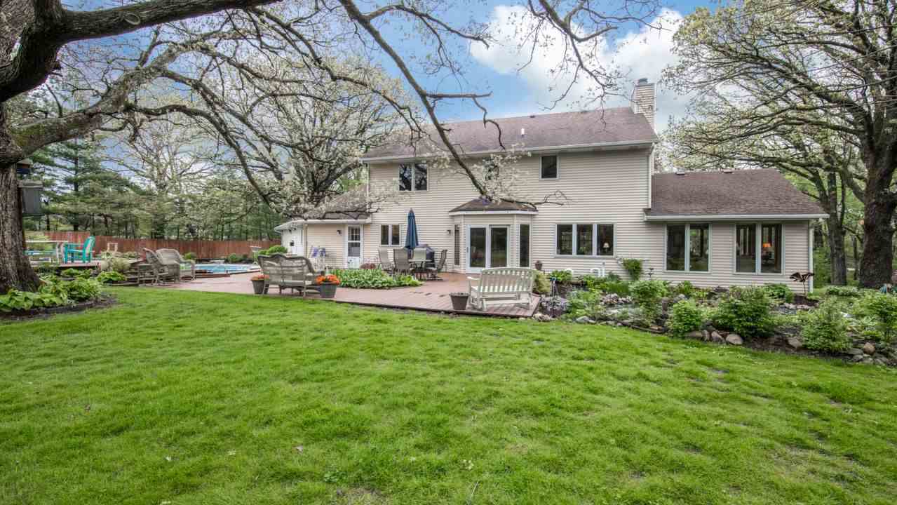 11900 Beloit Road Caledonia, IL 61011 - Photo 5 of 27 a front view of a house with garden and trees