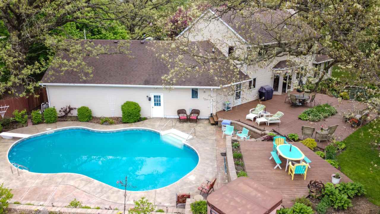 11900 Beloit Road Caledonia, IL 61011 - Photo 7 of 27 an aerial view of a swimming pool with seating space