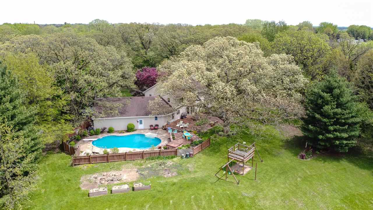 11900 Beloit Road Caledonia, IL 61011 - Photo 8 of 27 an aerial view of a house with a yard