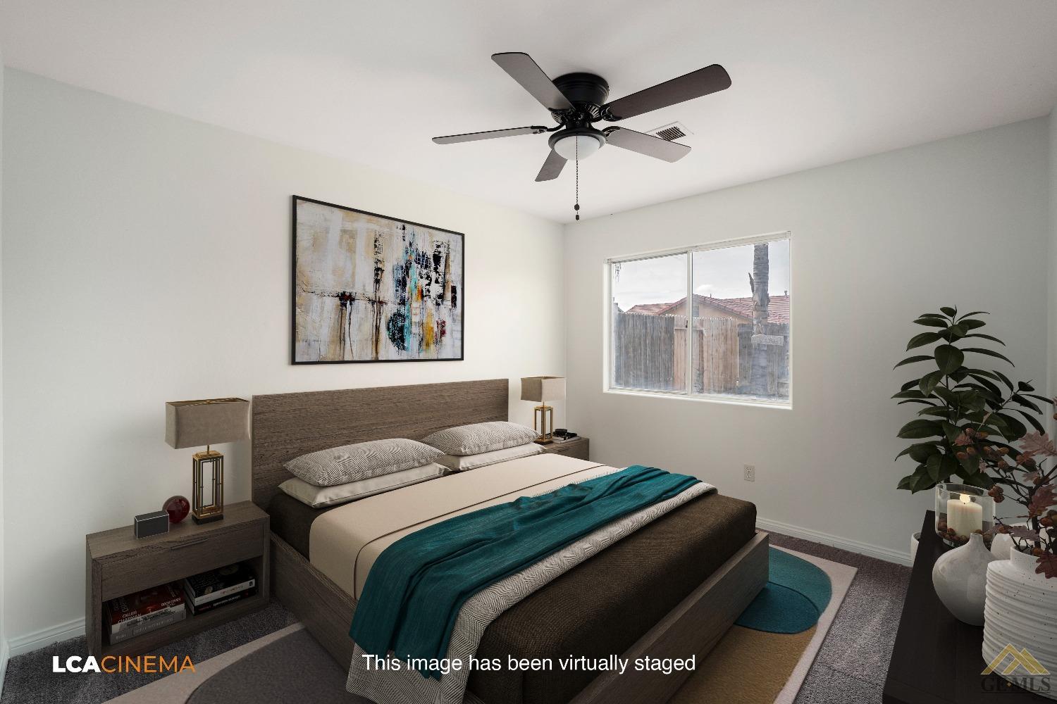 Undisclosed Address Bakersfield, CA 93308 - Photo 11 of 18 a bedroom with a bed and a window