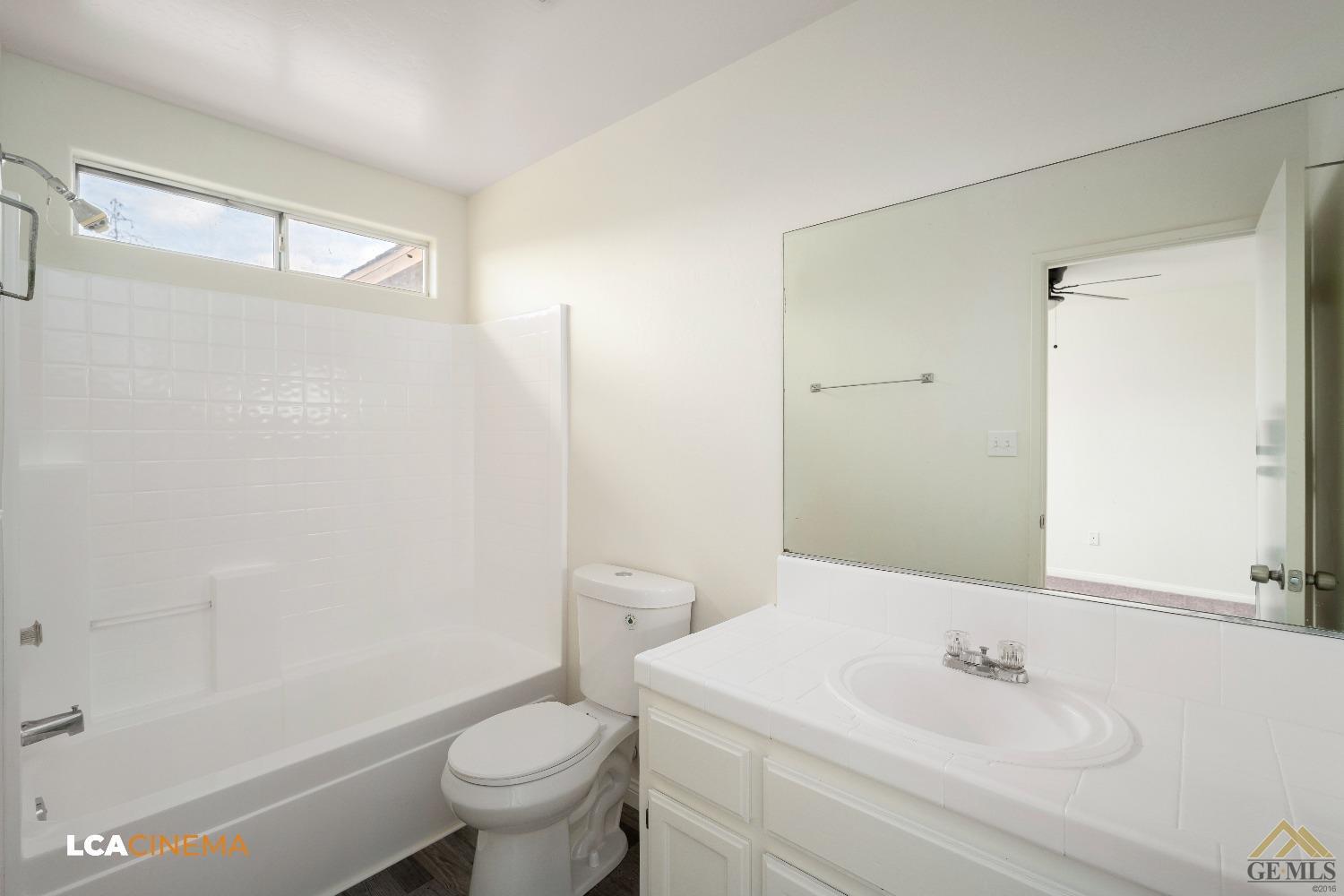 Undisclosed Address Bakersfield, CA 93308 - Photo 13 of 18 a bathroom with a sink toilet and shower