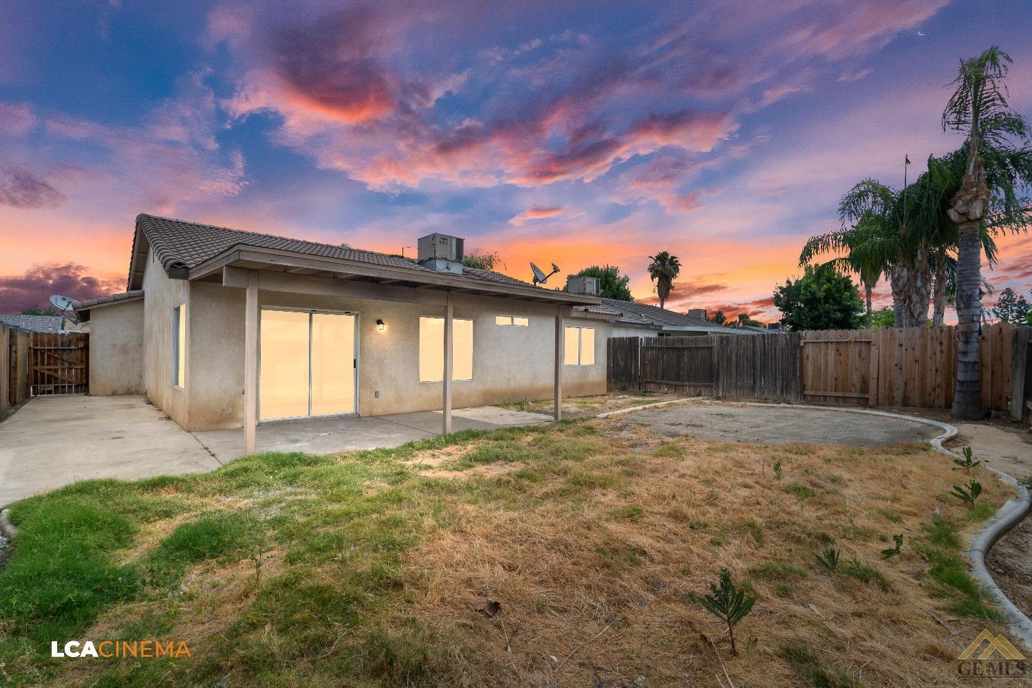 Undisclosed Address Bakersfield, CA 93308 - Photo 16 of 18 a backyard of a house with table and chairs