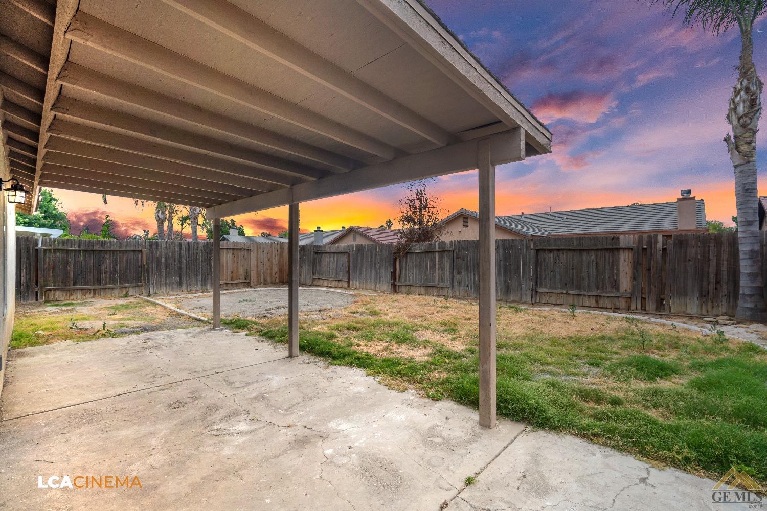Undisclosed Address Bakersfield, CA 93308 - Photo 17 of 18 a backyard of a house with table and chairs