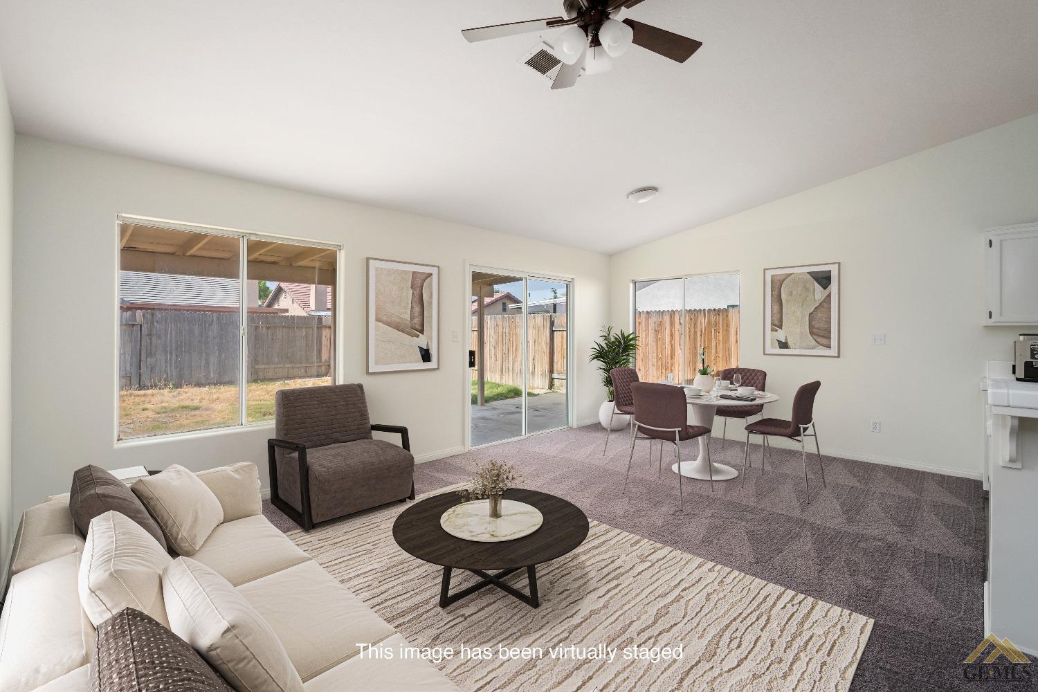 Undisclosed Address Bakersfield, CA 93308 - Photo 4 of 18 a living room with furniture and a table