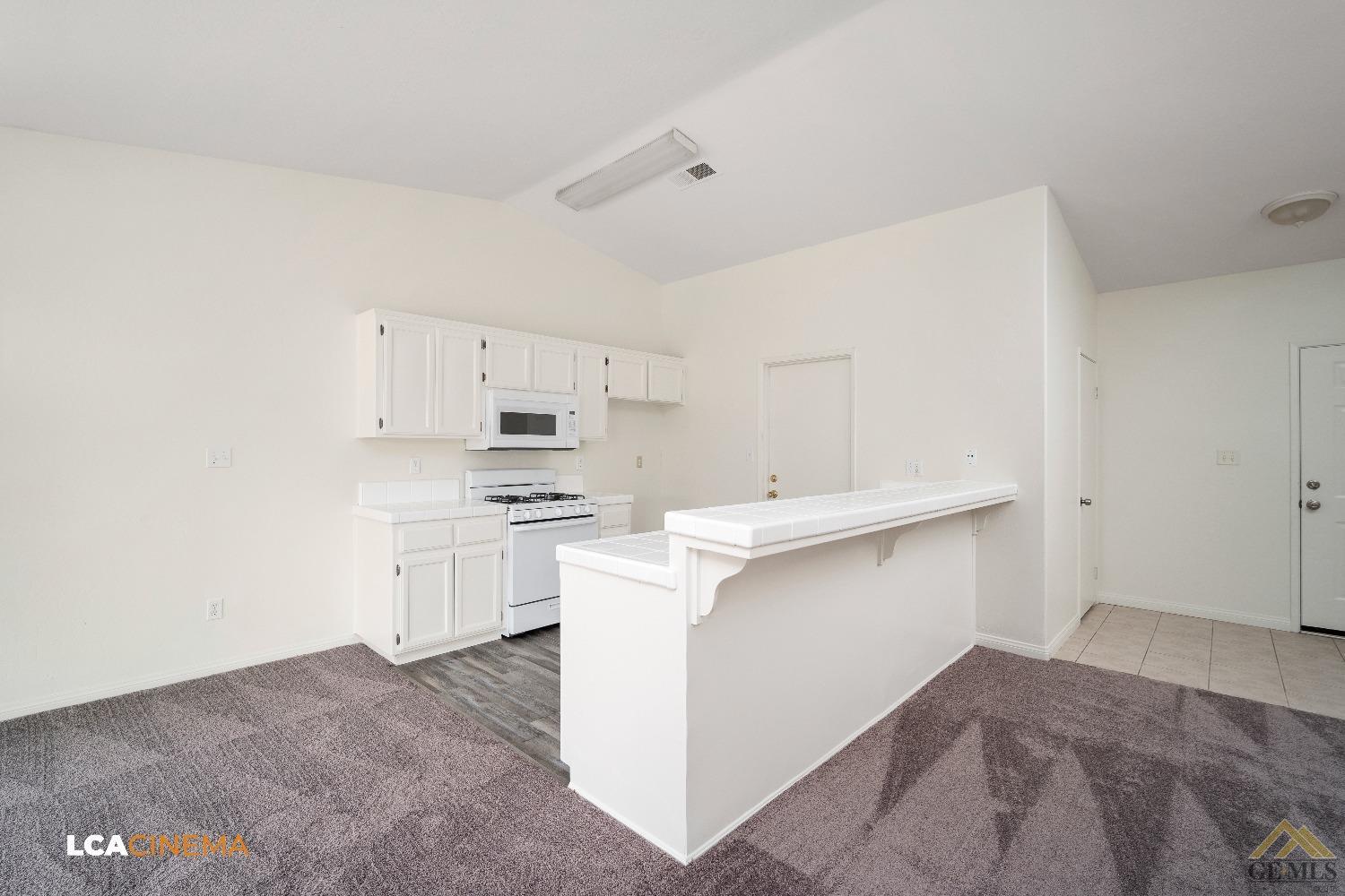 Undisclosed Address Bakersfield, CA 93308 - Photo 9 of 18 a kitchen with white cabinets and sink