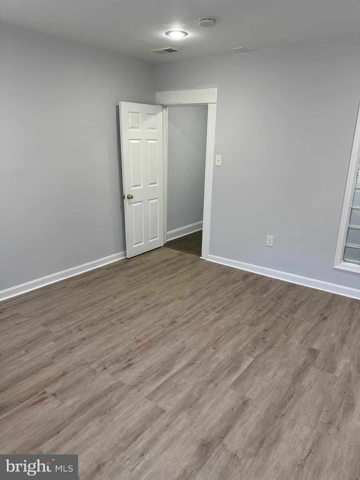 4331 Harford Road, Unit 2 Baltimore, MD 21214 - Photo 5 of 17 a view of an empty room with wooden floor
