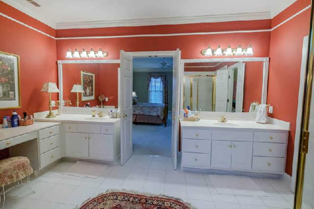 676 Pickney Road Winchester, TN 37398 - Photo 13 of 20 Double vanities in master bath with custom tiled shower and tile flooring