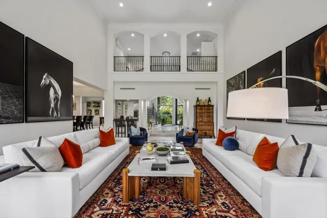 a living room with furniture rug and window