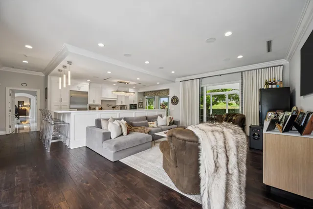 a living room with fireplace furniture and a flat screen tv