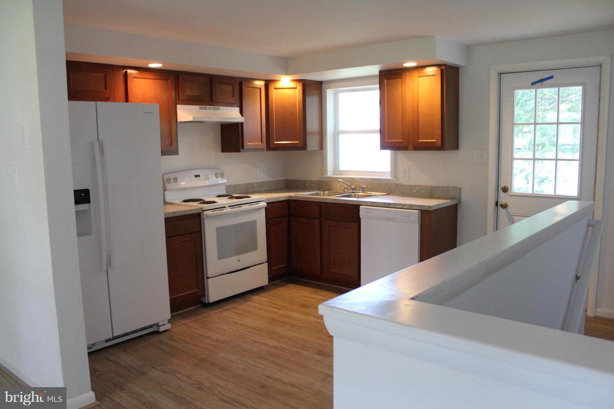 806 North Reymann Street Ranson, WV 25438 - Photo 11 of 25 a kitchen with stainless steel appliances granite countertop a sink stove and refrigerator